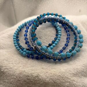 Blue Beaded Bracelet “Memory Wire” looks like a whole bunch of bracelets.